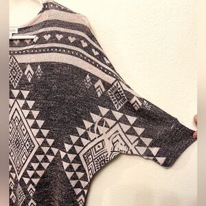 Charming Charlie knit-top. Lightweight, polyester, rayon, spandex.